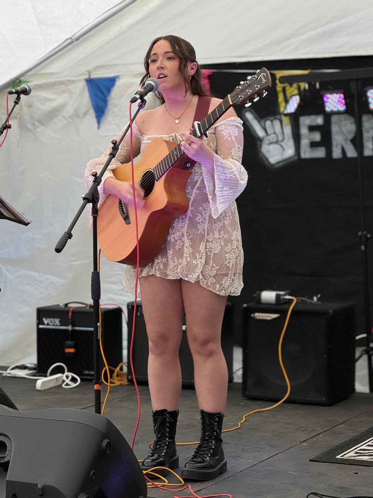 Portrait of Robyn Hearn with a warm backdrop